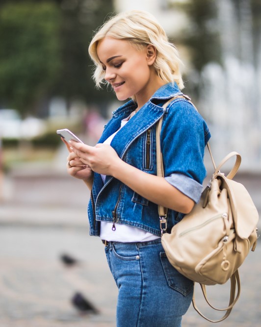 girl using mobile while shopping